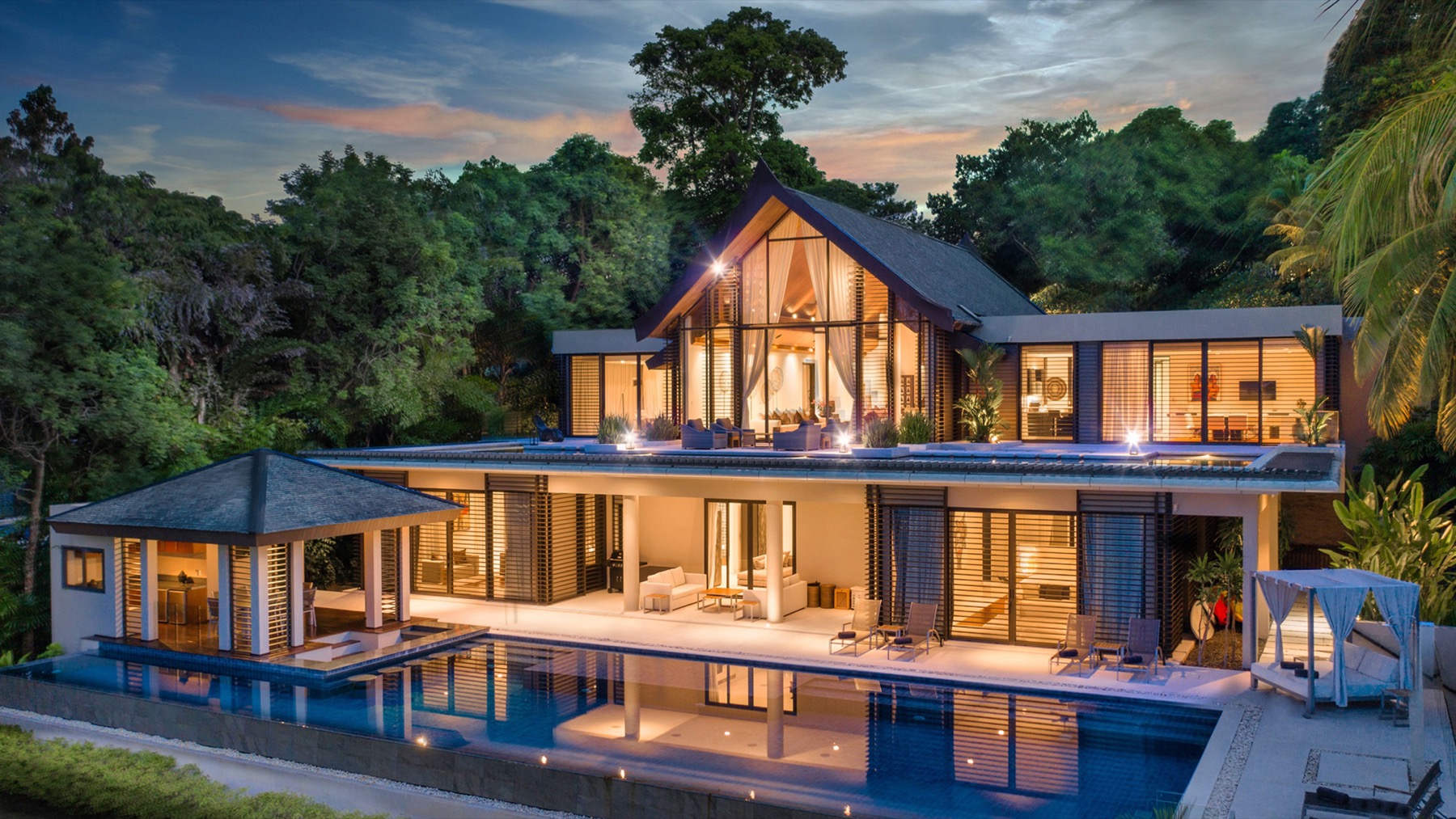 Villa facade reflected in the pool